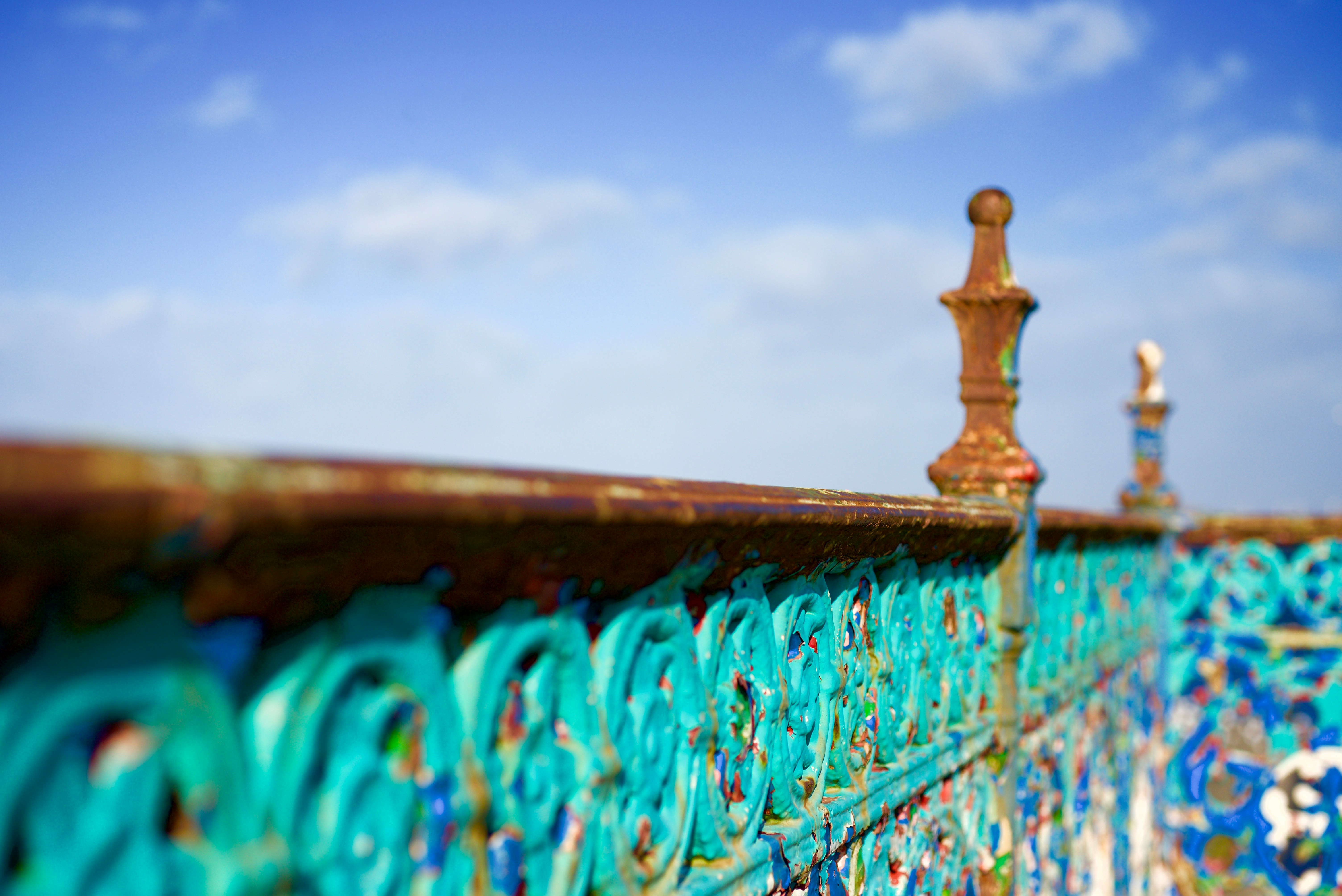 selective focus photo of brown metal pillar